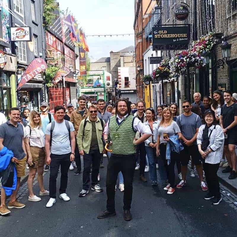 Dublin Tour Guide poses for group picture before a walking tour of Dublin City.