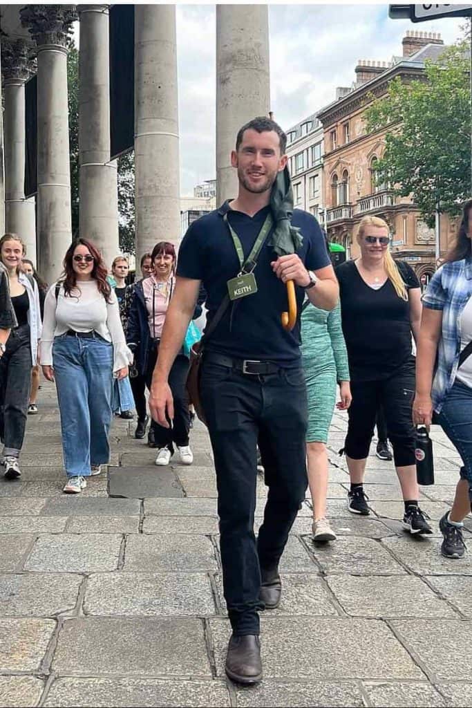 Dublin Tour Guide walks through College Green with Walking Tour